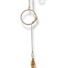Collier cravate avec écrous en laiton brut.